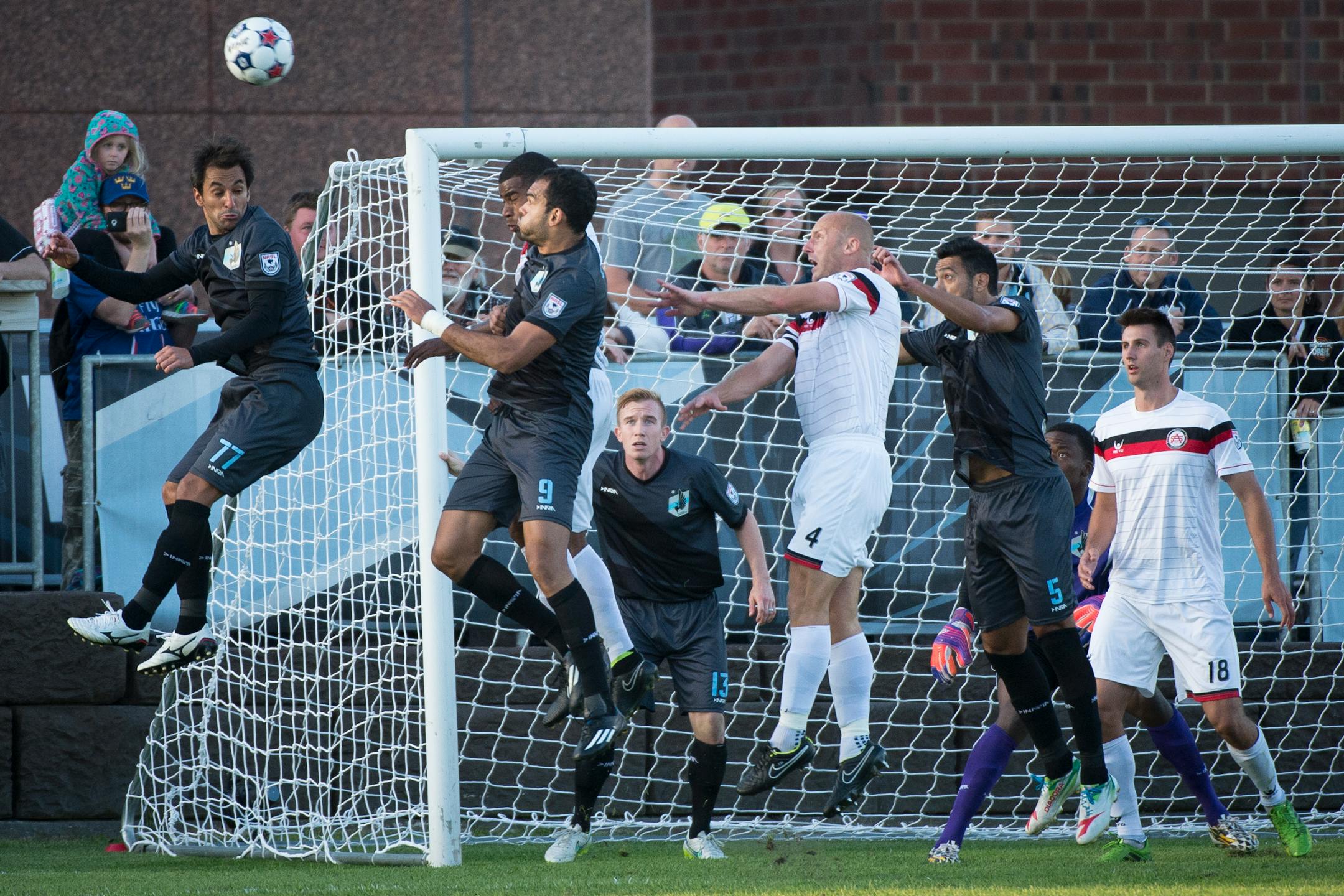 Minnesota United FC midfielder Juliano Elizeu Vicentini (77) and forward Pablo Campos (9) tried to score off a corner kick against Atlanta during a match in October. Atlanta's franchise folded after the season.