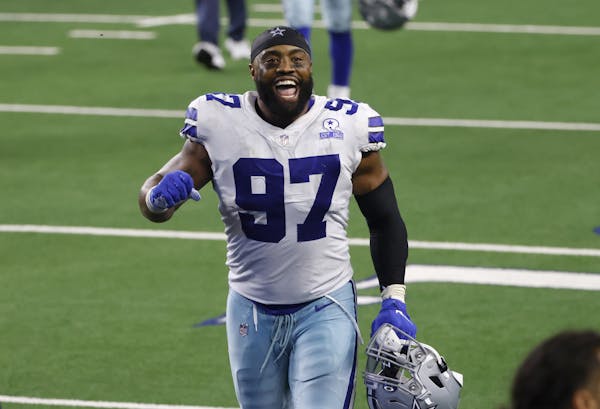 FILE - In this Oct. 11, 2020, file photo, Dallas Cowboys defensive end Everson Griffen celebrates after the team's win in an NFL football game against