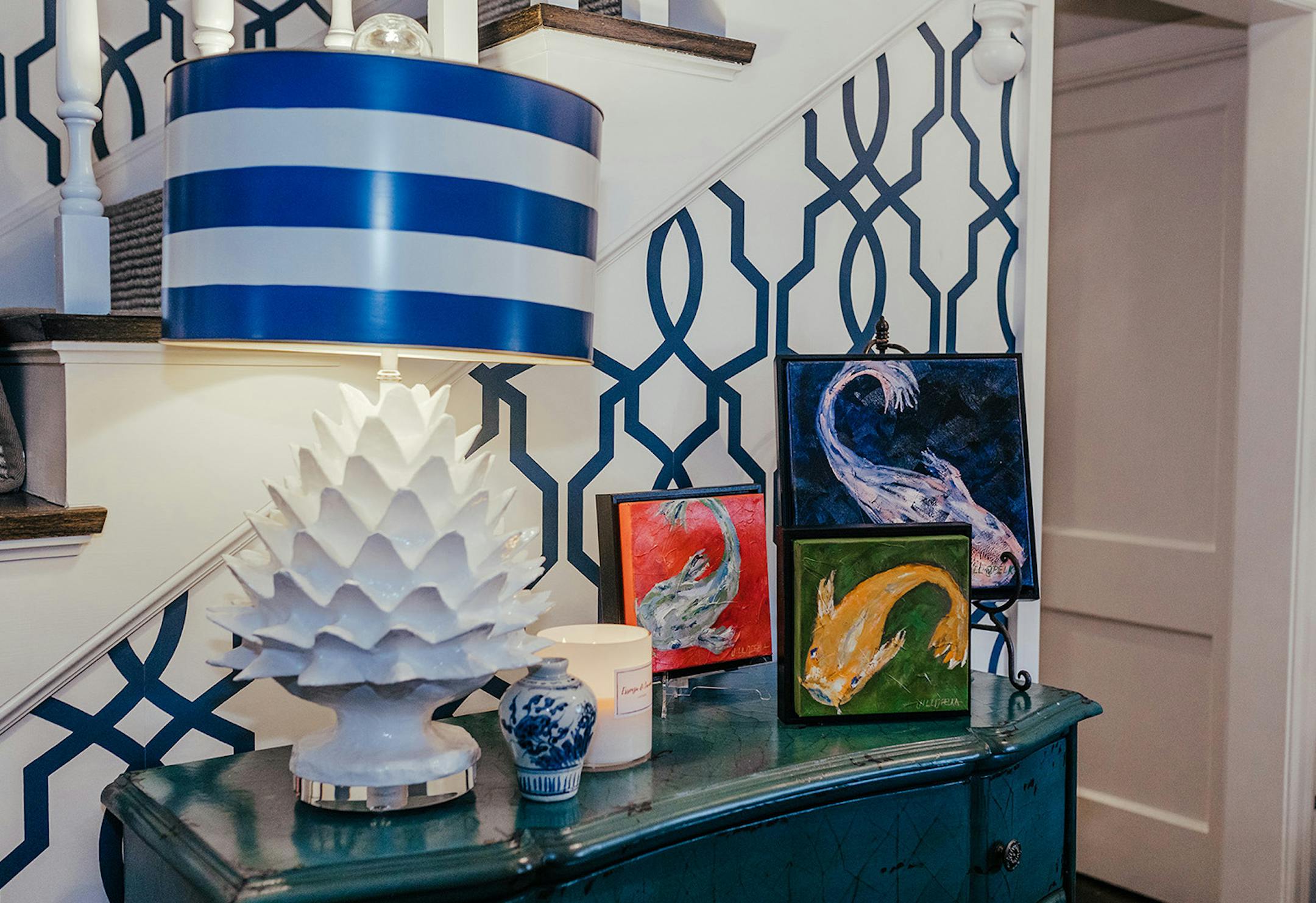 Don't be afraid to use large patterns in small spaces. A fun and colorful wallpaper or bright art is the perfect way to add personality in even the tiniest areas.