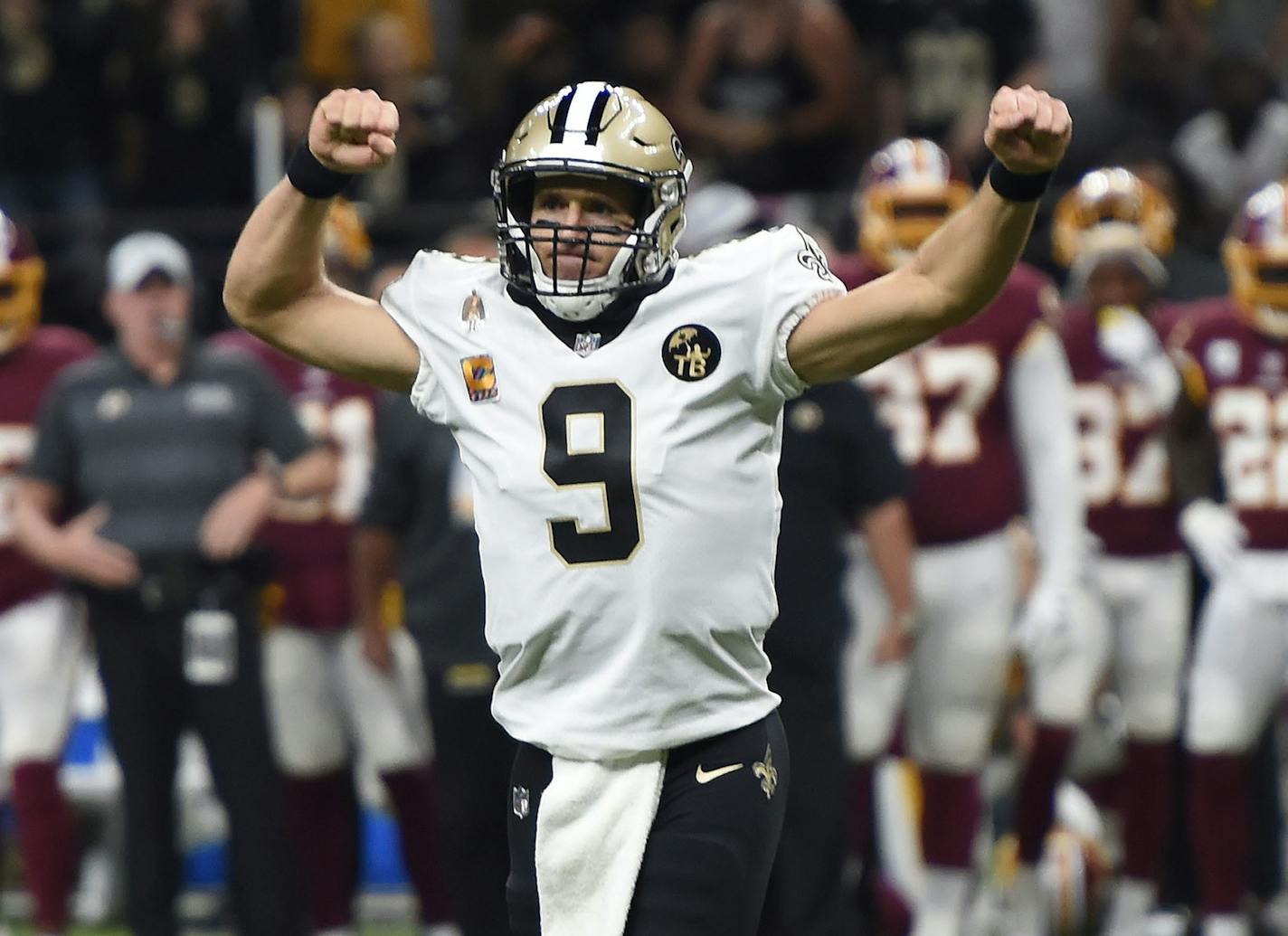 New Orleans Saints quarterback Drew Brees (9) reacts to a touchdown carry by running back Mark Ingram, not pictured, in the first half of an NFL football game against the Washington Redskins in New Orleans, Monday, Oct. 8, 2018. (AP Photo/Bill Feig) ORG XMIT: LAGH104