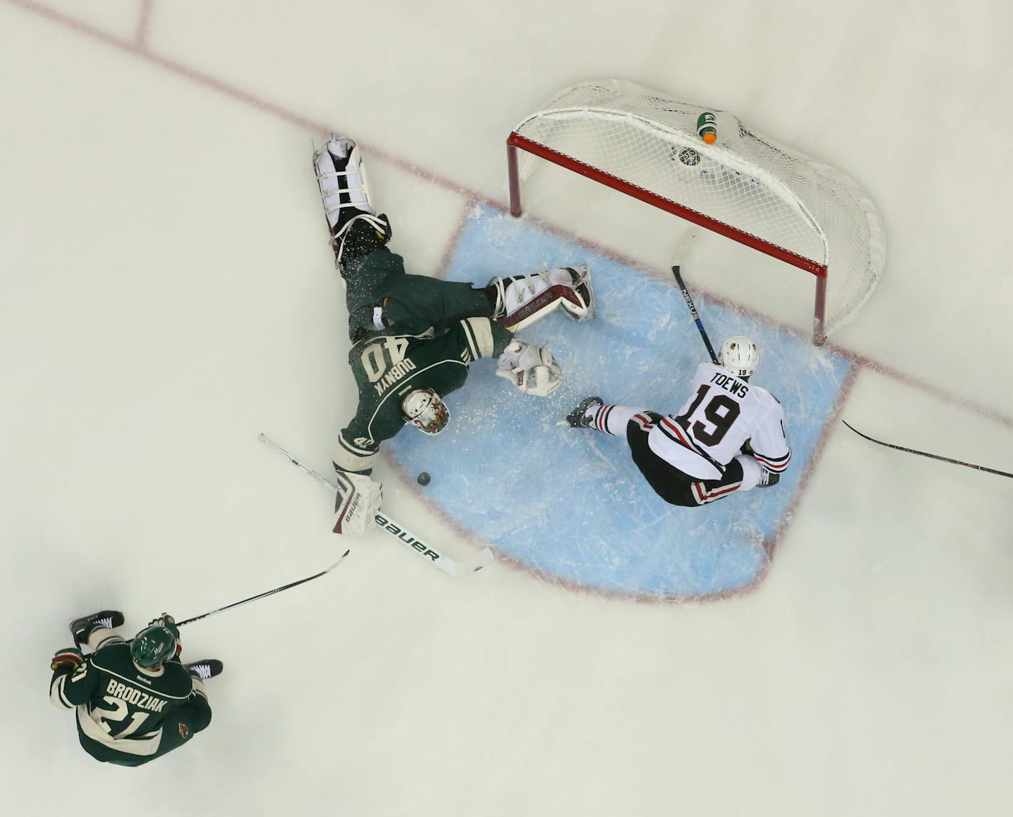 Wild goalie Devan Dubnyk (40) with a first period save of a breakaway shot by the Blackhawks' Jonathan Toews (19) Tuesday night. ] JEFF WHEELER � jeff.wheeler@startribune.com The Minnesota Wild lost 1-0 to the Chicago Blackhawks in the third game of their NHL playoff series Tuesday night, May 5, 2015 at Xcel Energy Center in St. Paul.