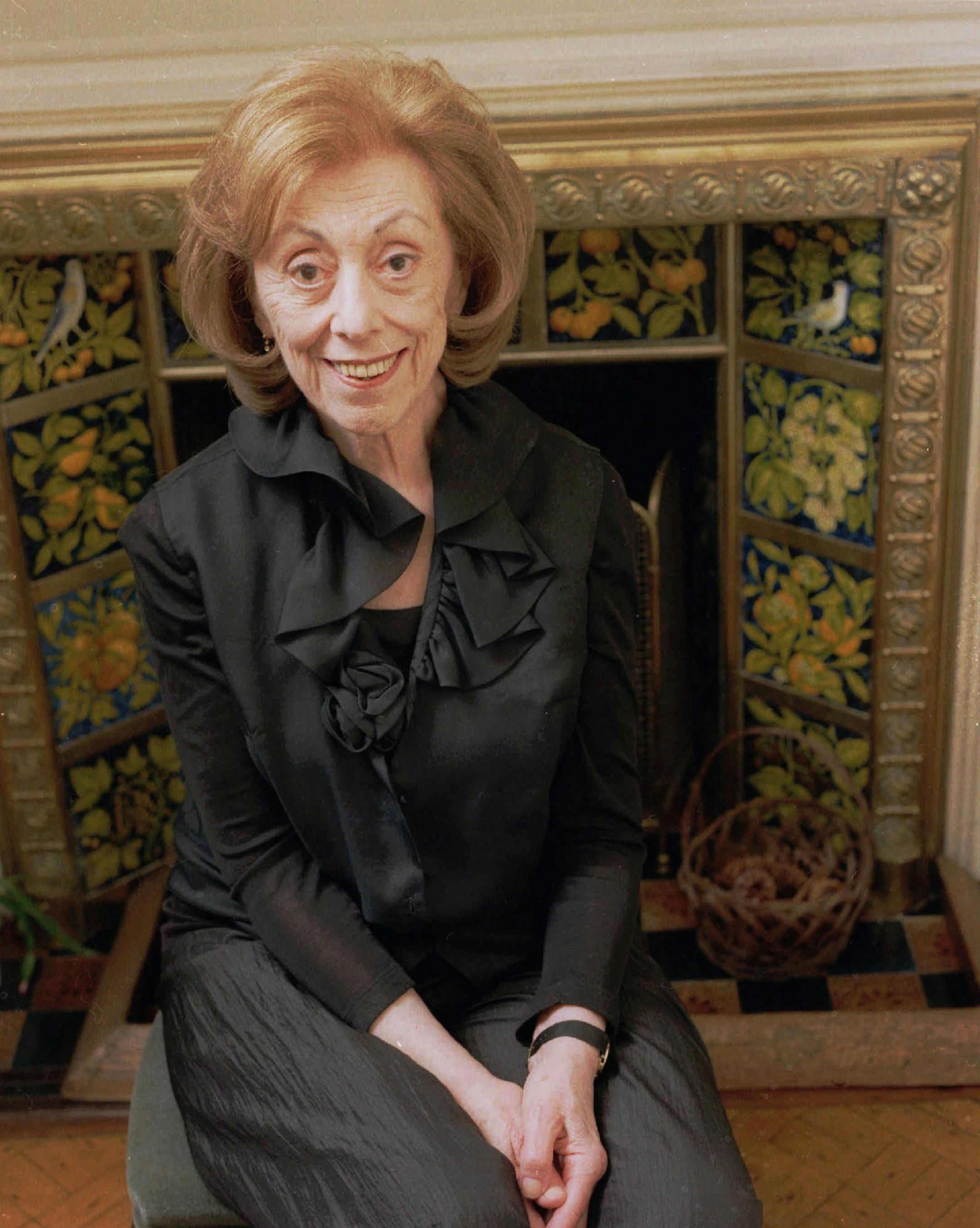 In this Nov. 26, 1997 file photo, author Hortense Calisher poses for a portrait at her apartment in New York. Calisher, a prize-winning writer and former president of PEN known for her dense, unskimmable prose in such works of fiction as "False Entry" and "In Greenwich There Are Many Gravelled Walks," has died. She was 97.