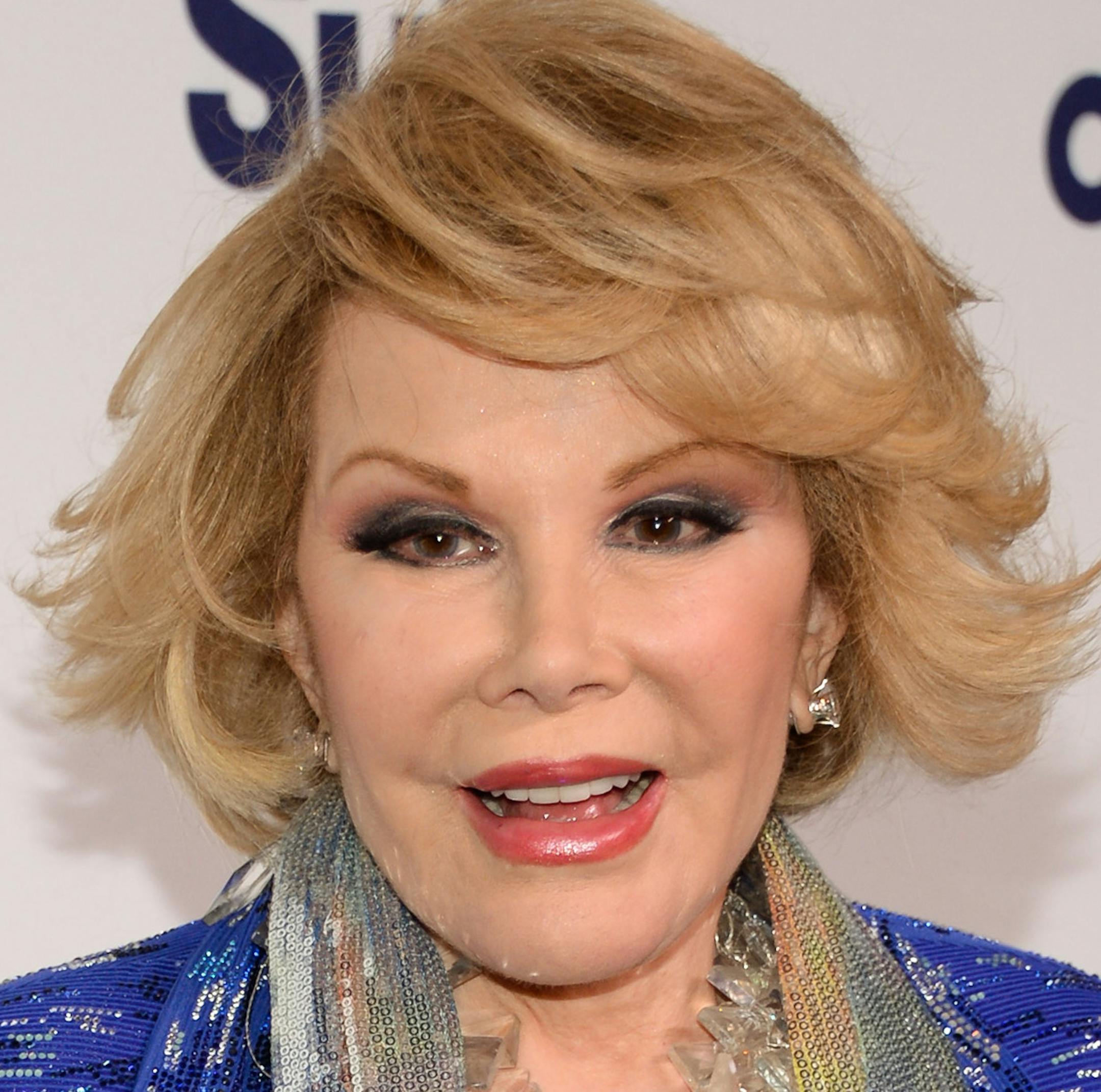 FILE - In this May 15, 2014 file photo, Joan Rivers attends the NBCUniversal Cable Entertainment 2014 Upfront at the Javits Center in New York. For comedians, there was very little to laugh about in 2014. Three pioneering comic legends died - David Brenner, Rivers and Robin Williams. (Photo by Evan Agostini/Invision/AP, File)