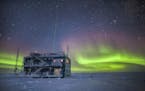 This undated photo provided by NOAA in May 2018 shows aurora australis near the South Pole Atmospheric Research Observatory in Antarctica. When a hole