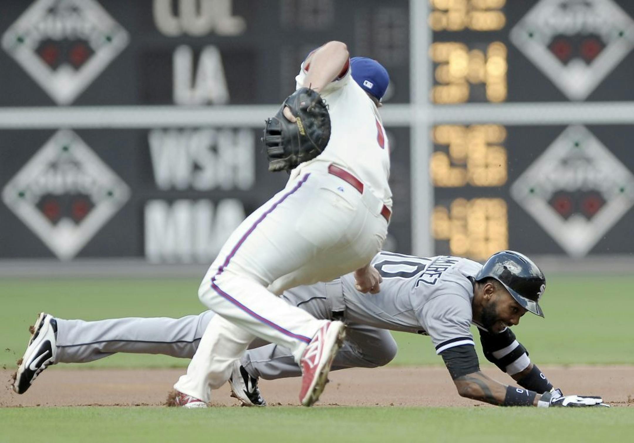 Philadelphia Phillies' Darin Ruf catches Chicago White Sox's Alexei Ramirez in a run-down and tags him out in the first inning during game one of a doubleheader interleague baseball game on Saturday, July 13, 2013, in Philadelphia.