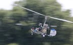Doug Hughes flies his gyrocopter March 17, 2015, near the Wauchula Municipal Airport in Wauchula, Fla. Hughes wants to shine a spotlight on campaign f