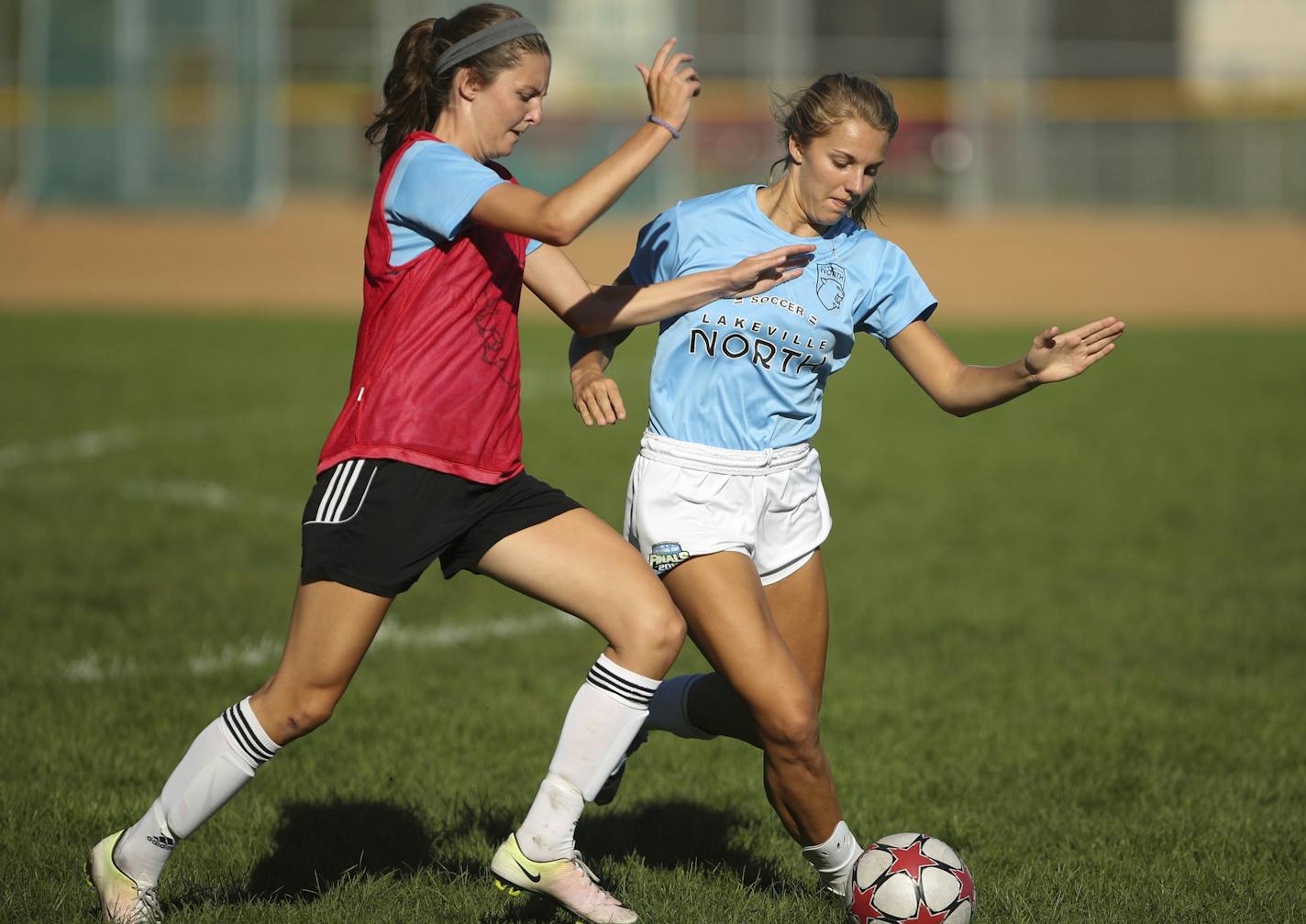 Lakeville North's Haley Steel, left, and Temi Carda fought for the ball during a scrimmage Wednesday afternoon. ] JEFF WHEELER &#xef; jeff.wheeler@startribune.com Lakeville North girls' soccer practiced Wednesday afternoon, August 31, 2016 at the school.