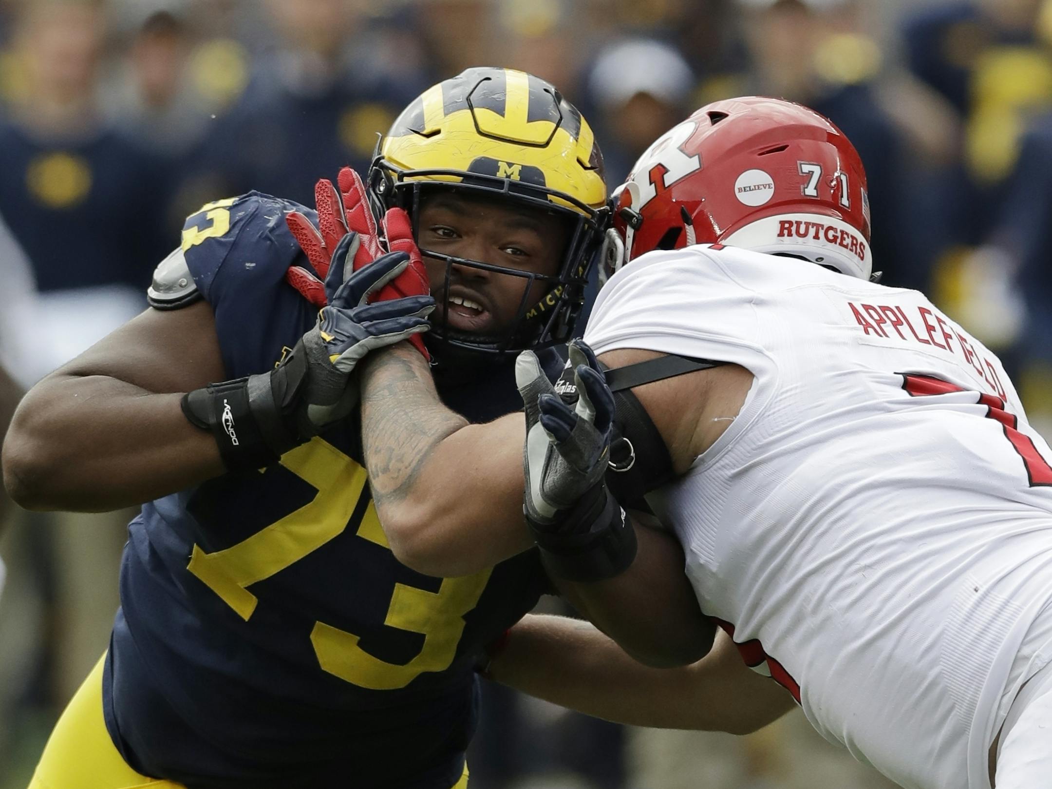 Michigan defensive lineman Maurice Hurst (73) goes up against Rutgers offensive lineman Marcus Applefield (71) during the second half of an NCAA college football game, Saturday, Oct. 28, 2017, in Ann Arbor, Mich. (AP Photo/Carlos Osorio)
