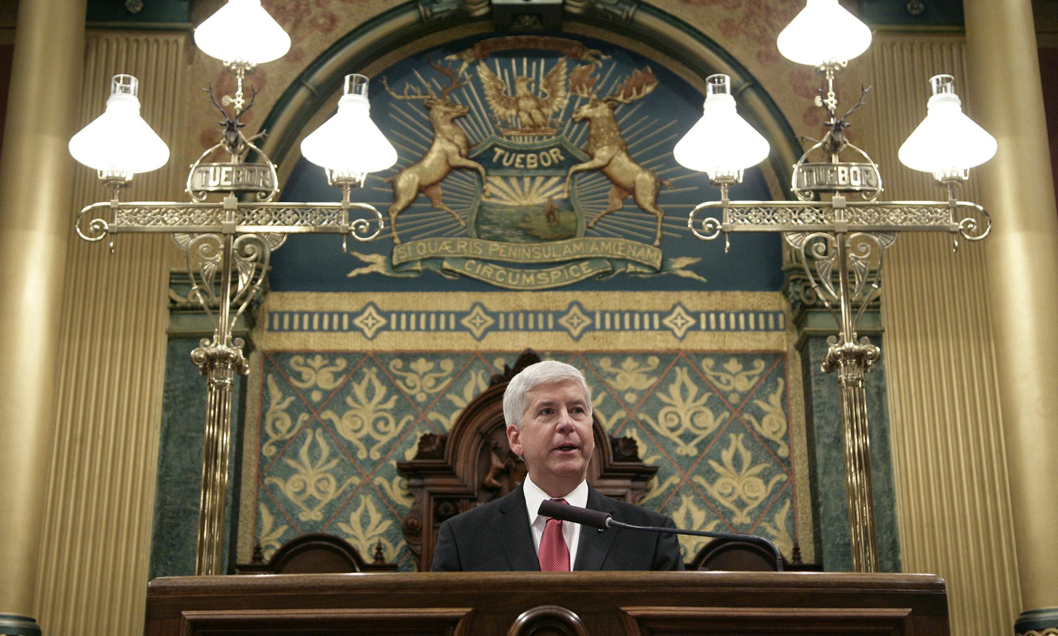 Michigan Gov. Rick Snyder delivers his State of the State address to a joint session of the House and Senate, Tuesday, Jan. 19, 2016, at the state Capitol in Lansing, Mich. With the water crisis gripping Flint threatening to overshadow nearly everything else he has accomplished, the Republican governor pledged a fix Tuesday night during his annual State of the State speech. (AP Photo/Al Goldis) ORG XMIT: MIN2016011919114838
