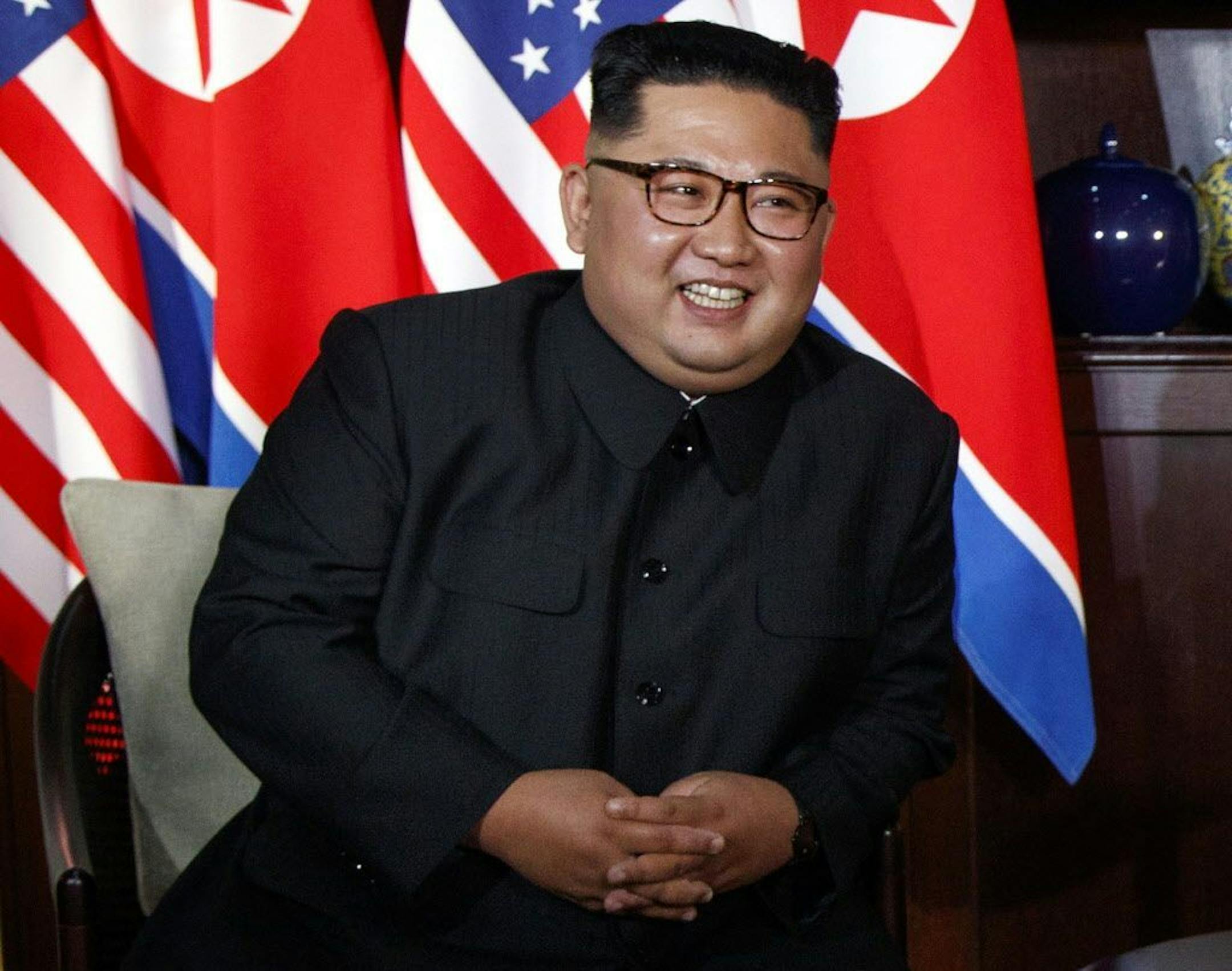 North Korean leader Kim Jong Un smiles as he meets with President Donald Trump on Sentosa Island, Tuesday, June 12, 2018, in Singapore.