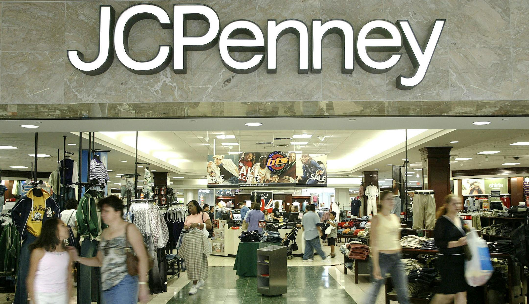 FILE - In this Aug. 16, 2005 file photo, customers walk out of a J.C. Penny department store in Dallas. J.C. Penney said Friday, Feb. 24, 2017, that it will be closing anywhere from 130 to 140 stores as well as two distribution centers over the next several months as it aims to improve profitability in the era of online shopping.(AP Photo/Matt Slocum)