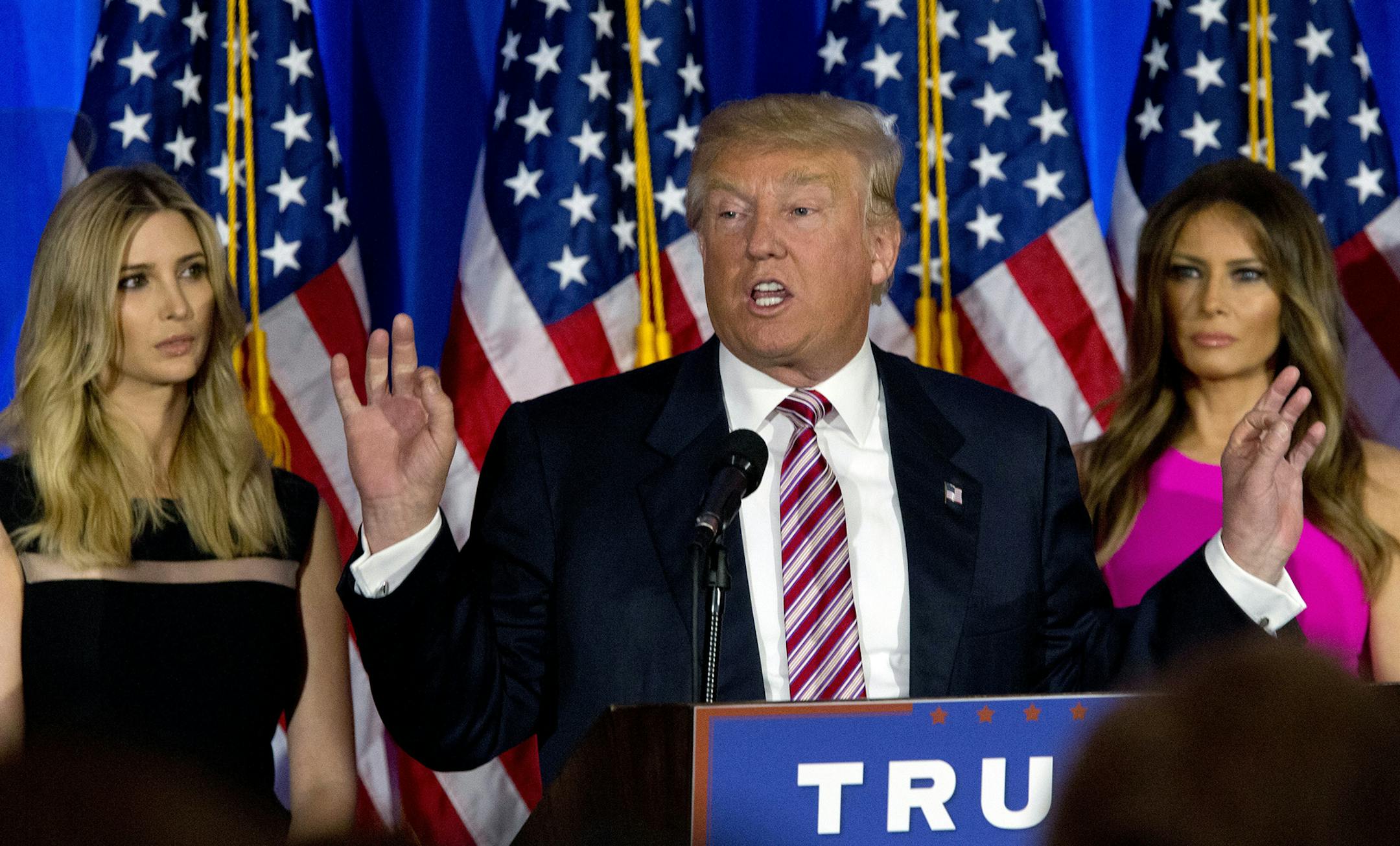 Republican presidential candidate Donald Trump is joined by his daughter Ivanka, left, and wife Melania as he speaks during a news conference at the Trump National Golf Club Westchester, Tuesday, June 7, 2016, in Briarcliff Manor, N.Y. (AP Photo/Mary Altaffer) ORG XMIT: MIN2016060811421726