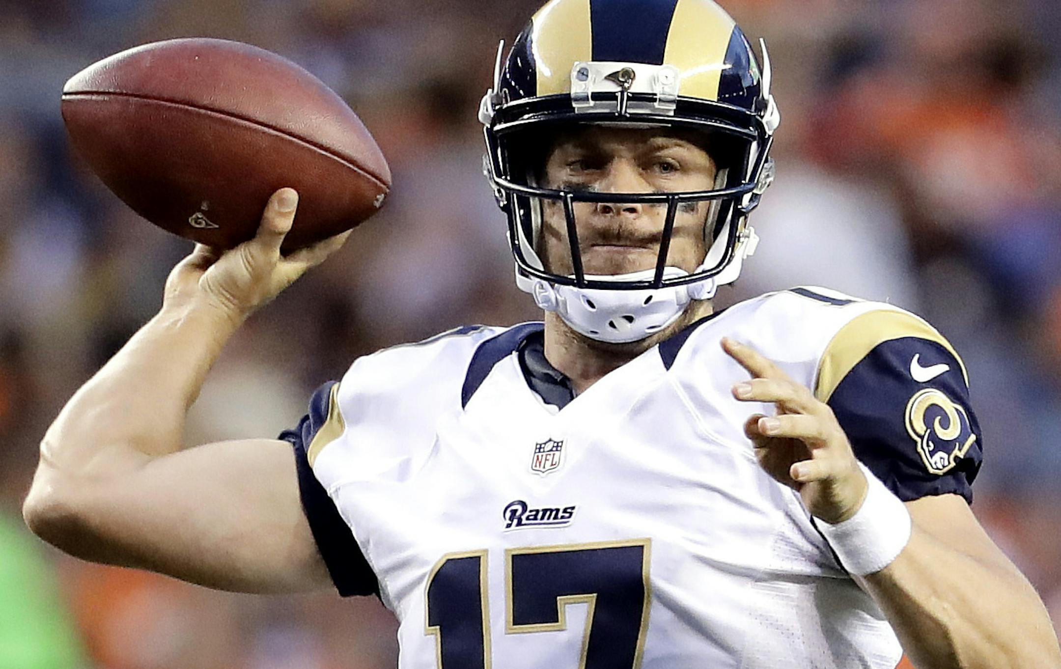 Los Angeles Rams quarterback Case Keenum (17) throws against the Denver Broncos during the first half of an NFL preseason football game, Saturday, Aug. 27, 2016, in Denver. (AP Photo/Jack Dempsey)