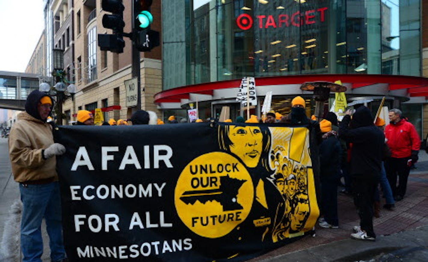 This morning Tuesday February 26, 2013 non union janitors picketed in front of the downtown Target store. About 50 people carried signs and shouted slogans while marching around the front entrance to the store. ] Richard.Sennott@startribune.com Richard Sennott/Star Tribune. , Minneapolis Minn. Tuesday 2/26/13) ** (cq)