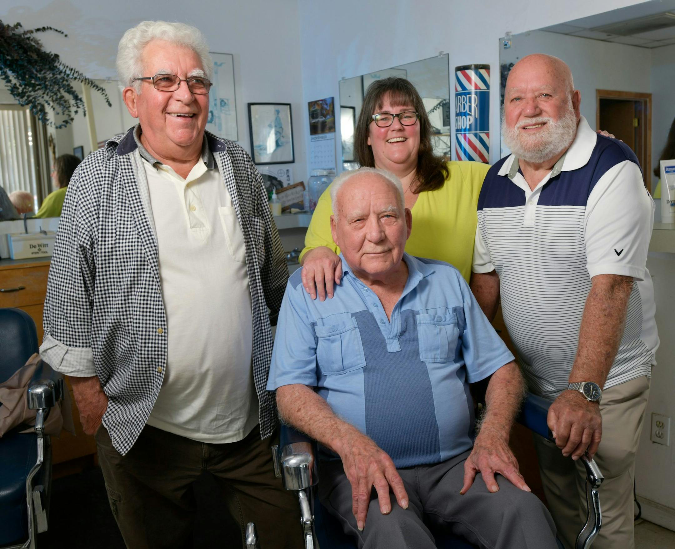 The Lowe brothers, from left, Glen, Don and Cal pose with Cal's daughter Gennifer Wright at Cal's Barber Shop Friday, November 22, 2019 in Jacksonville, Florida. The three brothers all owned barber shops in Jacksonville, but are now retired, and Gennifer now owns her father's shop. (Will Dickey/Florida Times-Union/TNS) ORG XMIT: 1511052 ORG XMIT: MIN1912101330075982