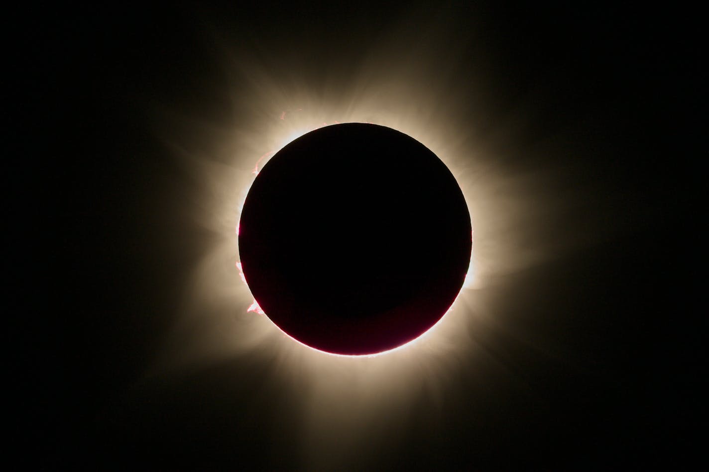 A total solar eclipse, seen from Exmouth, Australia, on Thursday, April 20, 2023. The narrow ribbon across the planet from which the eclipse could be seen crossed land in just four places: the remotest reaches of East Timor and Western Papua, in Indonesia; freckle-like Australian islands, one of which is controlled by the oil company Chevron; and Exmouth, a tiny tourist destination and former U.S. naval base 770 miles from the nearest city. (Matthew Abbott/The New York Times)