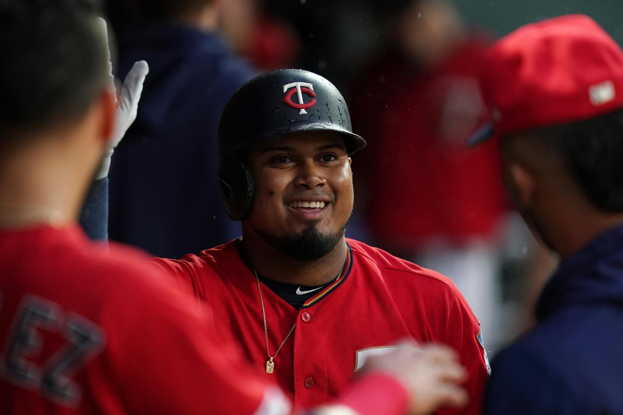 Minnesota Twins third baseman Luis Arraez (2) celebrated with his teammates in the dugout after hitting a home run in the second inning.