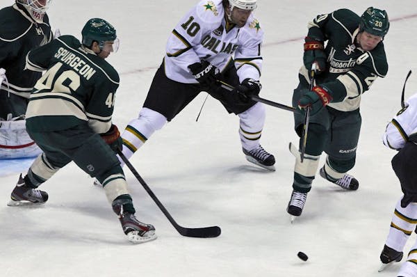 Ryan Suter, right, and his new defensive partner Jared Spurgeon, left, helped the Wild shut out Dallas 1-0 on Sunday. But tonight, Suter faces his old