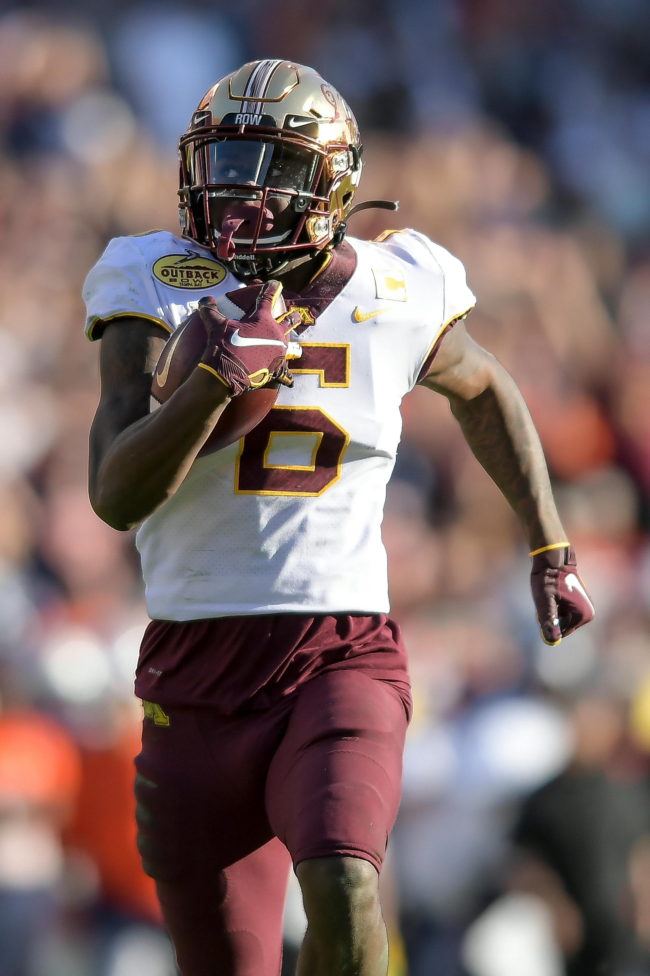 Minnesota Gophers wide receiver Tyler Johnson (6) ran the ball all the way to the end zone for a touchdown in the fourth quarter.