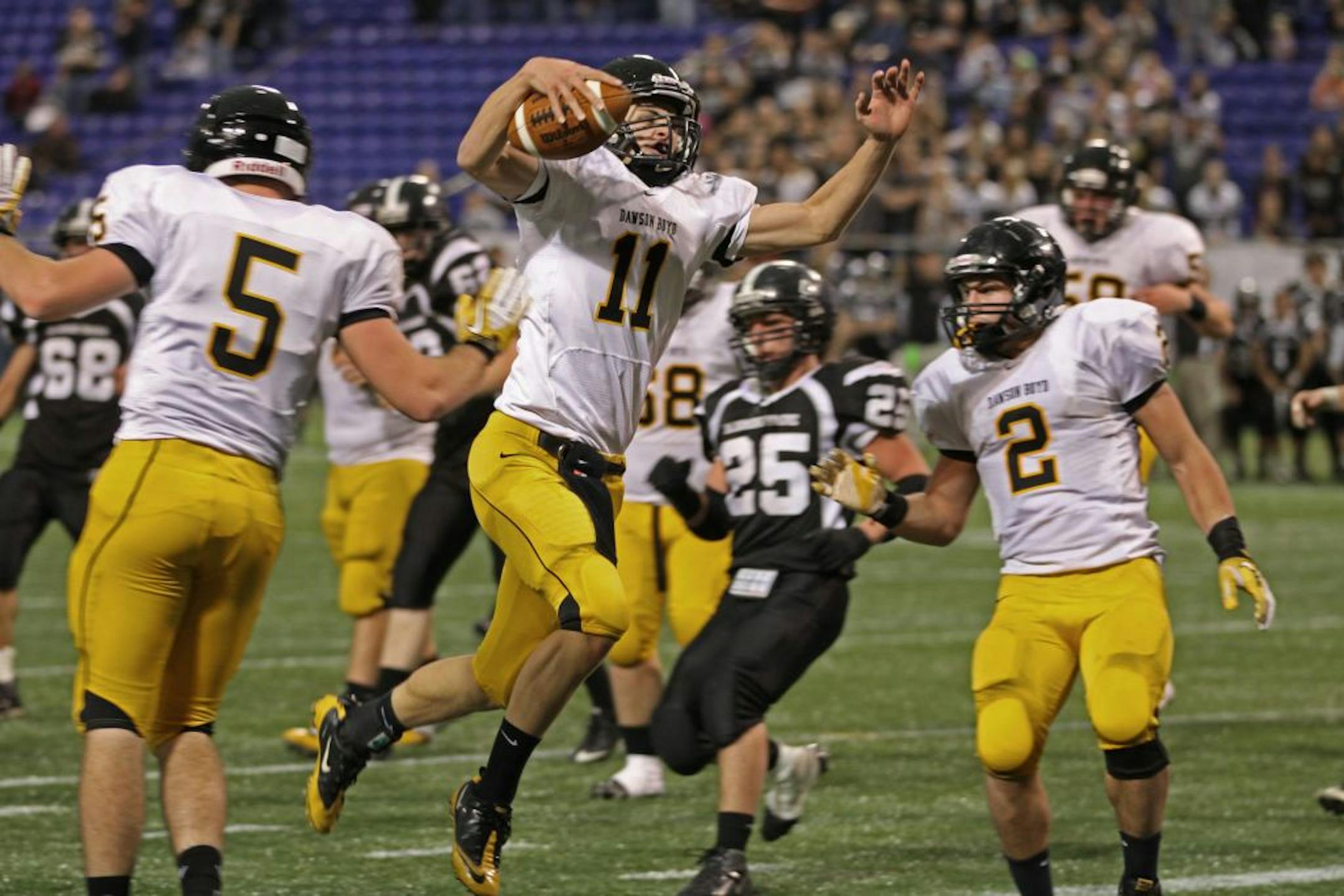 Dawson-Boyd vs. Blooming Prairie in Class A semi-final game at the Dome on 11/19/11. (center) Dawson-Boyd quarterback Joey Lee jumped into the end zone for a touchdown in the last seconds of the first half against Blooming Prairie. Lee scored on a quarterback keeper.