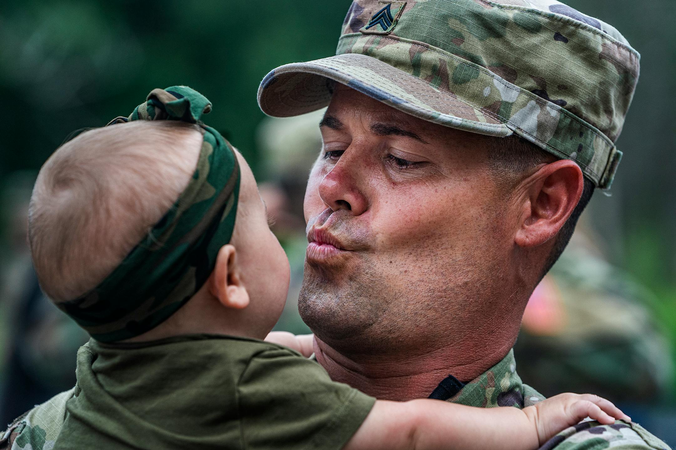 Sgt. Shawn Blakemore blew a kiss to his six-month-old daughter Liv. He most likely will miss her first birthday as the deployment will last about a year. Approximately 150 soldiers from the Stillwater-based 34th Military Police Company will deploy to Naval Station Guantanamo Bay in support of Joint Task Force Guantanamo to provide base security.