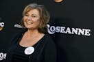 FILE - In this March 23, 2018, file photo, Roseanne Barr arrives at the Los Angeles premiere of "Roseanne."