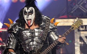 Gene Simmons performs with Kiss.