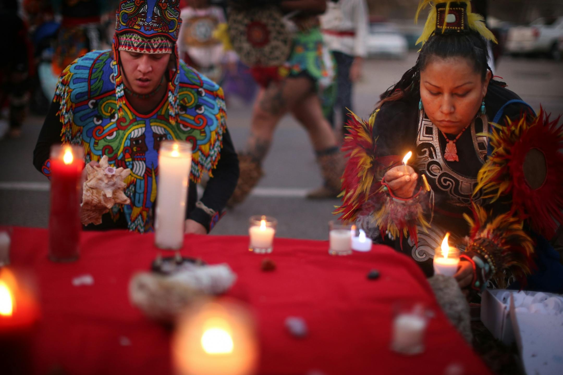 Indigenous dancers burned candles and sage at the site where Jamar Clark was killed in a confrontation with city police last fall to commemorate his death Tuesday October 15, 2016 in Minneapolis, MN.