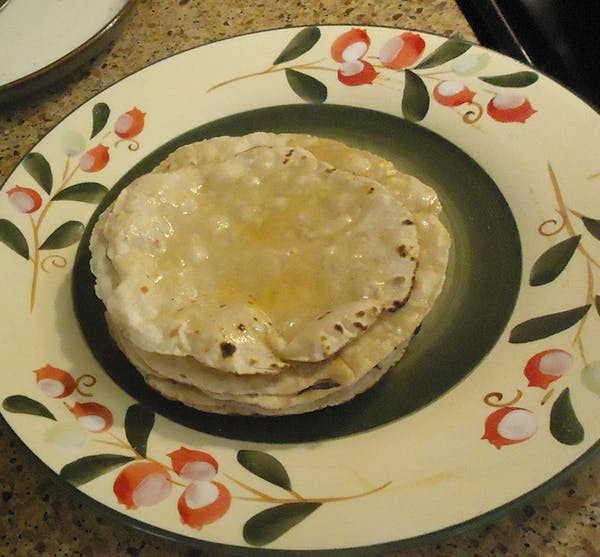 The Indian flatbread roti is often served with ghee, or clarified butter.