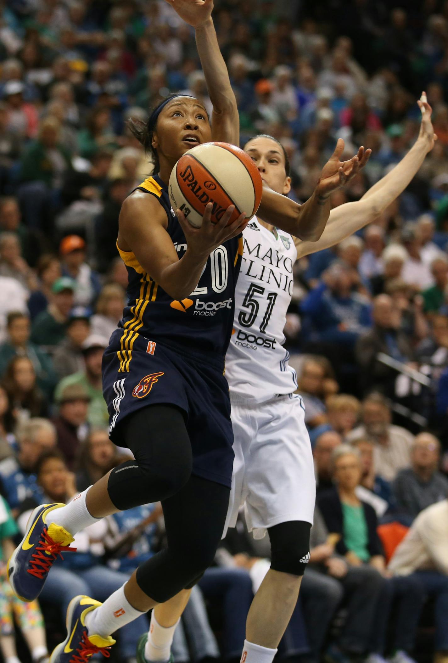 Indiana's Briann January drove passed Lynx Anna Cruz for the basket during the second half. ] (KYNDELL HARKNESS/STAR TRIBUNE) kyndell.harkness@startribune.com Game 1 of the WNBA Finals Lynx vs Indiana at the Target Center in Minneapolis Min., Sunday October 4, 2015. Indiana wonder the Lynx 75-69.