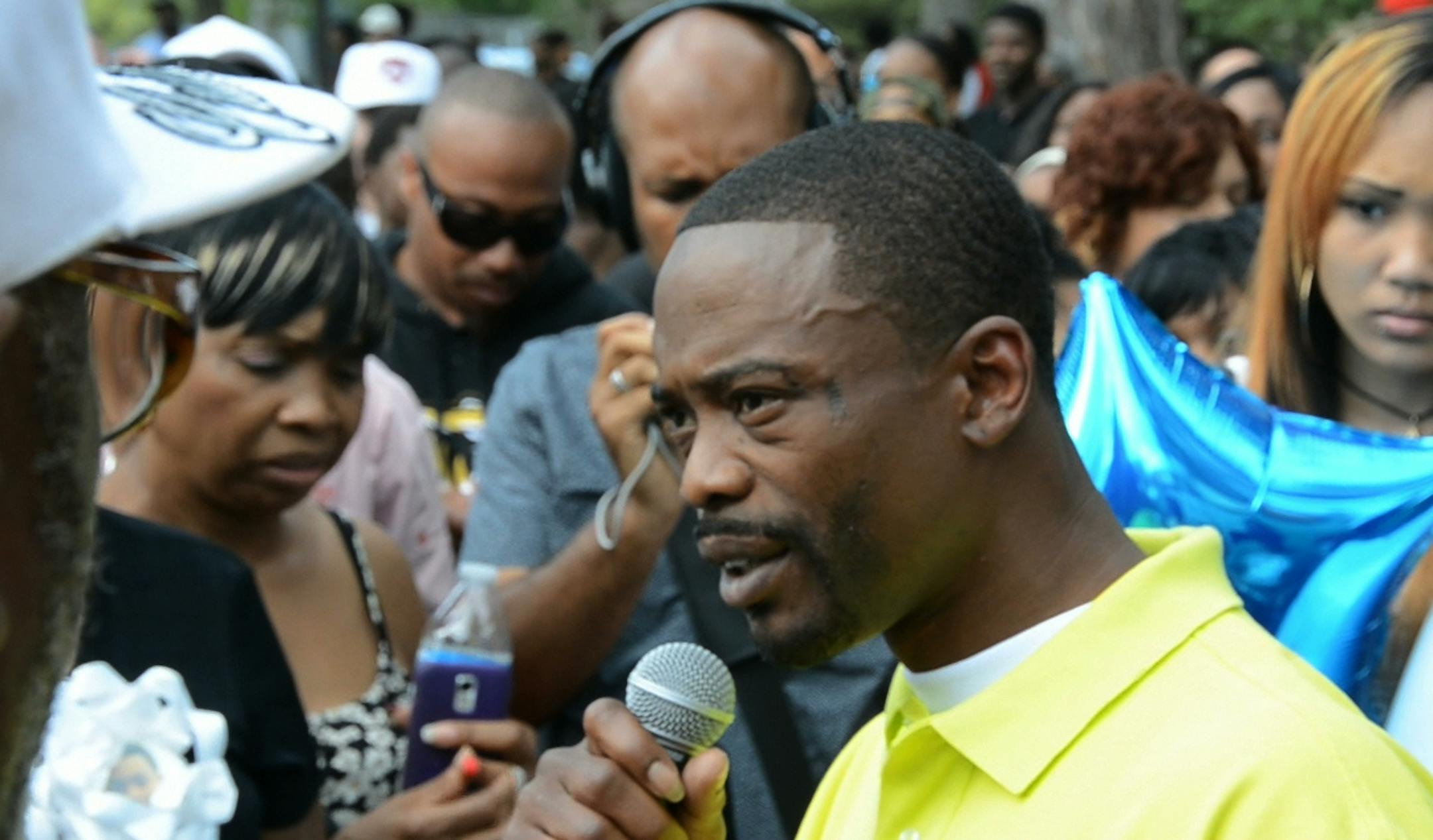 Nehemiah Steverson's father, Randy Donnerson, spoke to the crowd gathered for a community vigil against gun violence. The Wednesday night vigil was held in North Commons Park in north Minneapolis. ] DAVID BREWSTER/STAR TRIBUNE