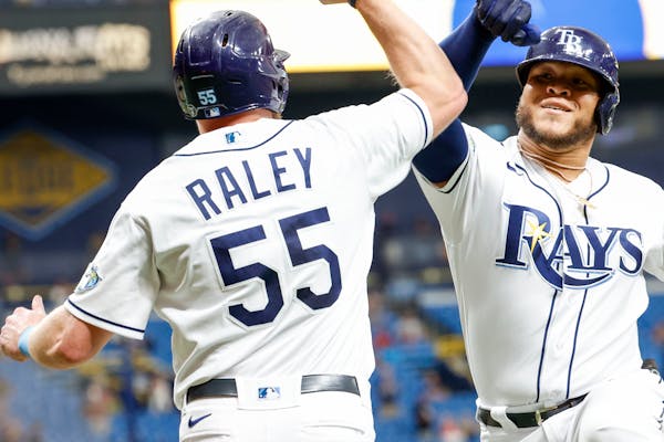 Tampa Bay Rays first baseman Luke Raley (55), left, and designated hitter Harold Ramirez (43), right, celebrate a two-run home run in the fourth innin