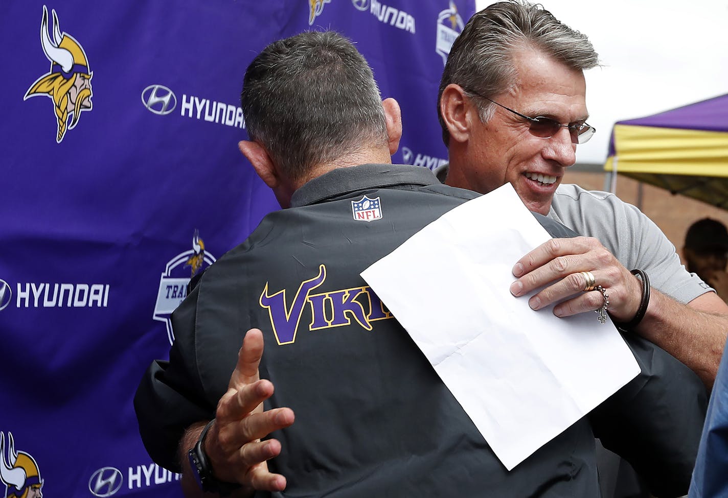 Minnesota Vikings head coach Mike Zimmer got a hug from general manager Rick Spielman after it was announced that Zimmer received a contract extension. ] CARLOS GONZALEZ cgonzalez@startribune.com - July 28, 2016, Mankato, MN, Minnesota State University, Mankato, Minnesota Vikings Training Camp