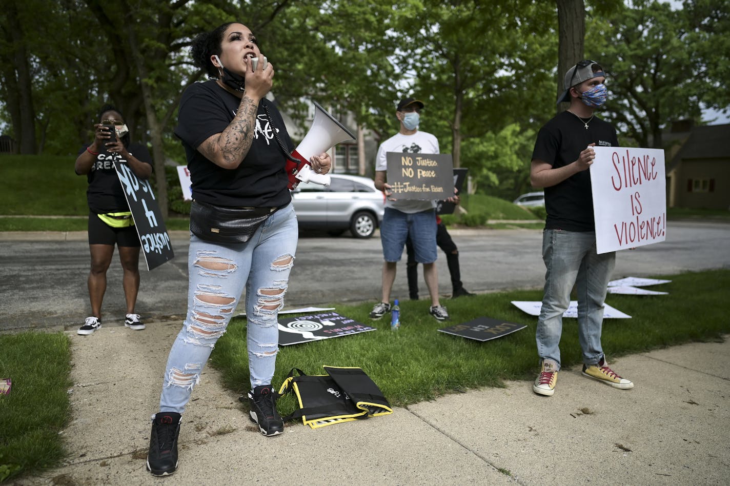 Ashley Quinones, widow of Brian Quinones, who was killed by Edina and Richfield police in 2019, protested outside Hennepin County Attorney Mike Freeman's home Wednesday. ] aaron.lavinsky@startribune.com A protest was held outside the home of Hennepin County Attorney Mike Freeman's home on Wednesday, May 27, 2020 in Minneapolis, Minn. Mayor Jacob Frey on Wednesday called for an arrest and charges against the now-fired Minneapolis police officer Derek Chauvin who knelt on the neck of George Floyd