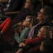 Karine Watne sat in the front row at Orchestra Hall with her twin daughters, Khloe, on her lap, and Kamille, 7. ] JEFF WHEELER &#xef; jeff.wheeler@sta