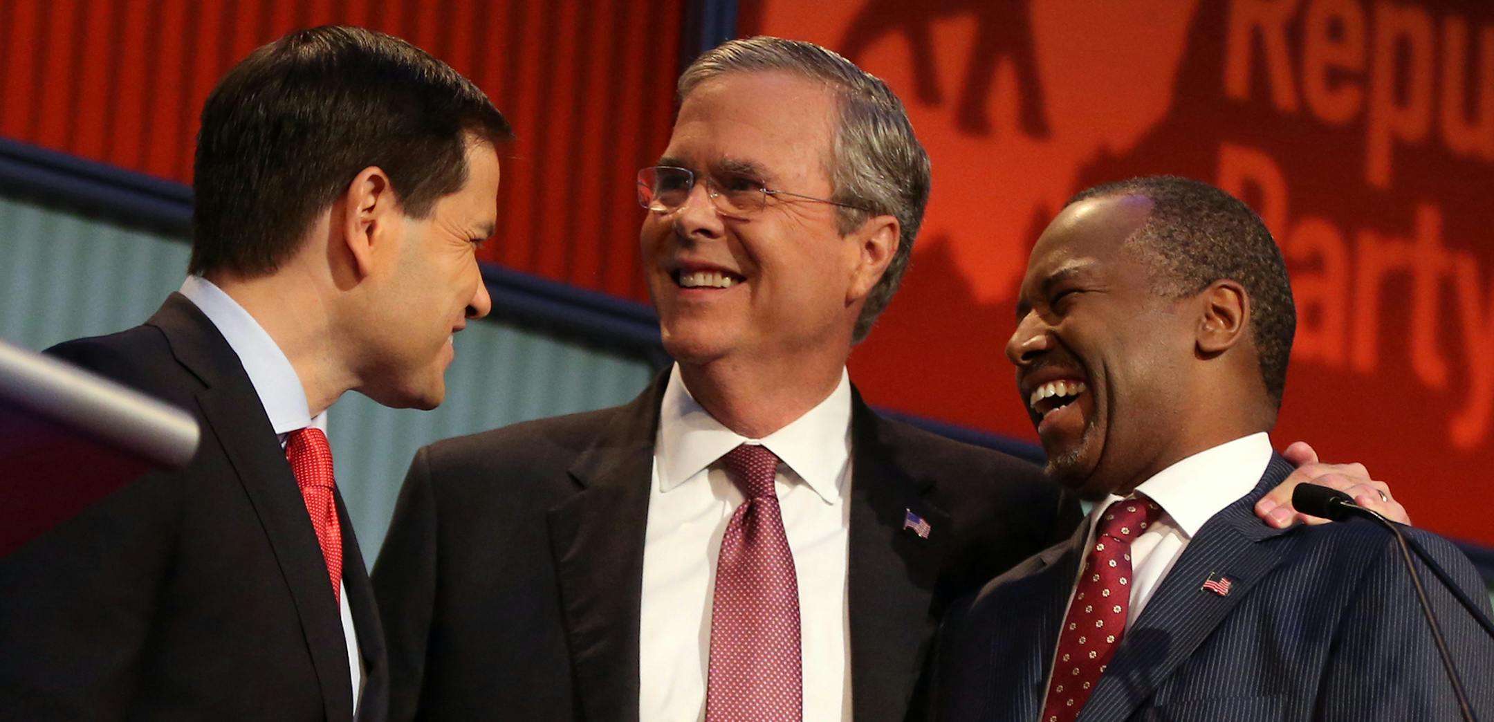 Republican presidential candidates from left, Marco Rubio, Jeb Bush and Ben Carson talk during a break during the first Republican presidential debate at the Quicken Loans Arena Thursday, Aug. 6, 2015, in Cleveland. (AP Photo/Andrew Harnik) ORG XMIT: MIN2015080621300304