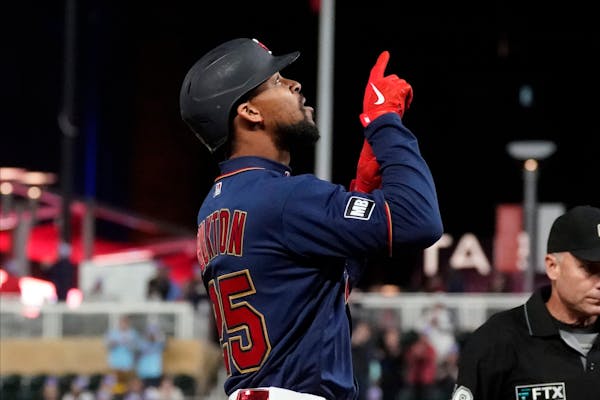 Minnesota Twins' Byron Buxton points skyward after his three-run home run off Toronto Blue Jays pitcher Jose Berrios in the third inning of a baseball