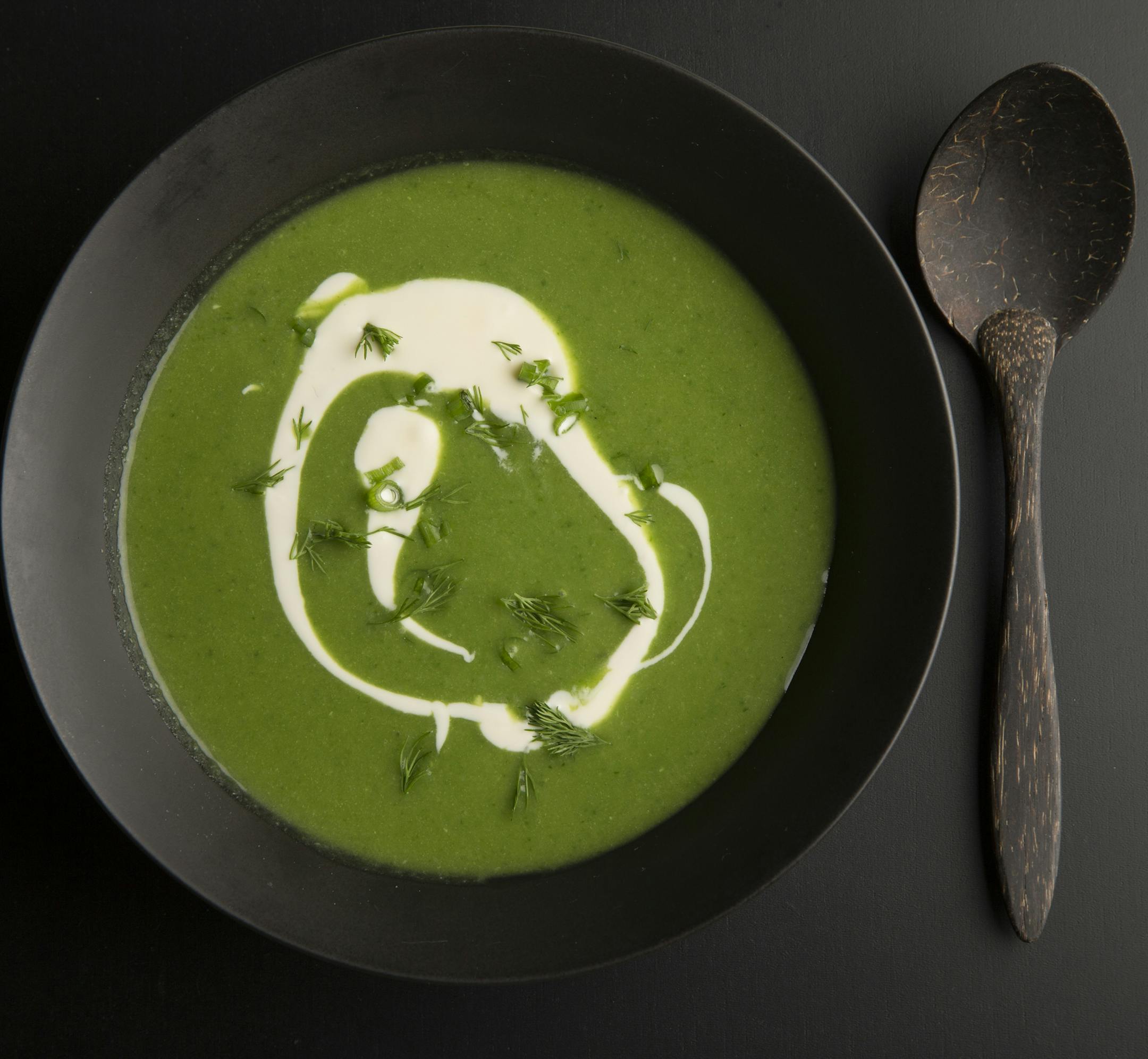 Leek soup topped with creme fraiche and herbs