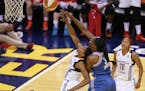 Lynx center Sylvia Fowles fouled Fever forward Tamika Catchings during the second half of Indiana's 75-69 victory in Game 4 of the WNBA FInals on Sund