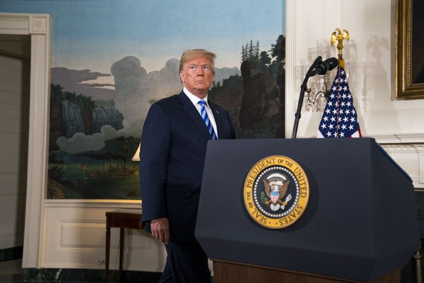 President Donald Trump arrives to deliver remarks on the Iran nuclear deal from the Diplomatic Room of the White House in Washington, May 8, 2018. President Trump declared on Tuesday that he was pulling out of the Iran nuclear deal, unraveling the signature foreign policy achievement of his predecessor, Barack Obama, and isolating the United States among its Western allies.