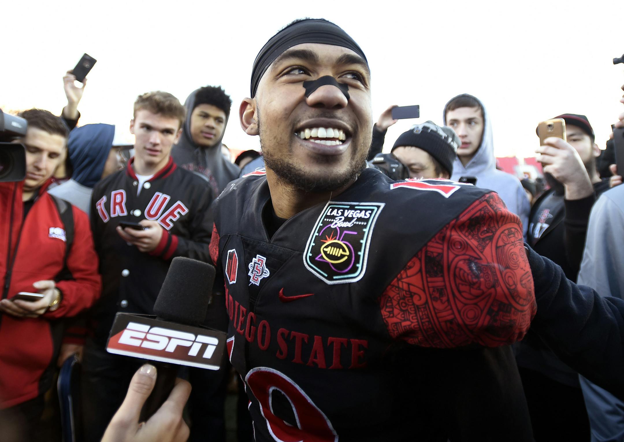 San Diego State running back Donnel Pumphrey smiles after being named the most valuable player after the Las Vegas Bowl NCAA college football game against Houston on Saturday, Dec. 17, 2016, in Las Vegas. San Diego State won 34-10. (AP Photo/David Becker)
