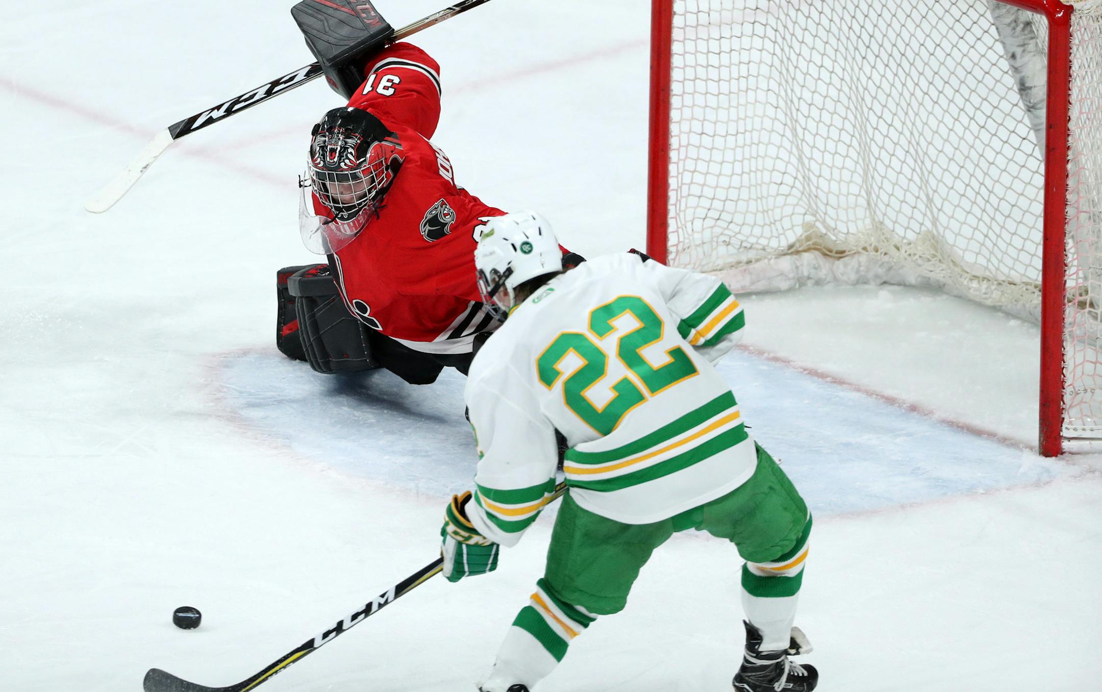 Edina High School wing Jett Jungels (22) scored a short handed goal on Lakeville North High School goaltender Will Johnson (31) in the second period. ] ANTHONY SOUFFLE ï anthony.souffle@startribune.com Edina High School played Lakeville North High School in an Class 2A boys' hockey quarterfinals game Thursday, March 8, 2018 at the Xcel Energy Center in St. Paul, Minn.