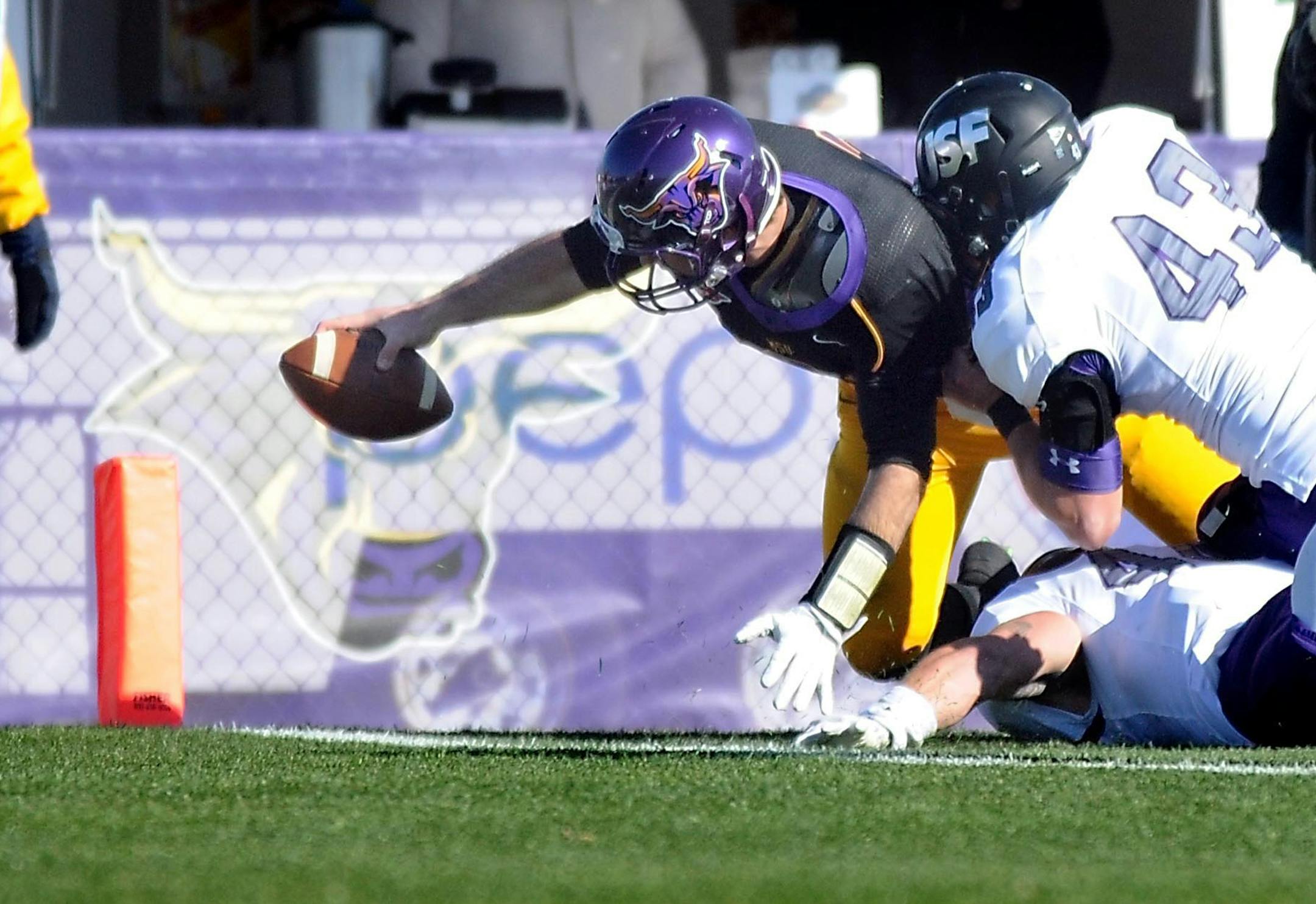 Minnesota State University, Mankato quarterback Nick Pieruccini dives for the end zone for a touchdown during the first half Saturday against the University of Sioux Falls at Blakeslee Stadium in Mankato. Photo by Pat Christman/Mankato Free Press
