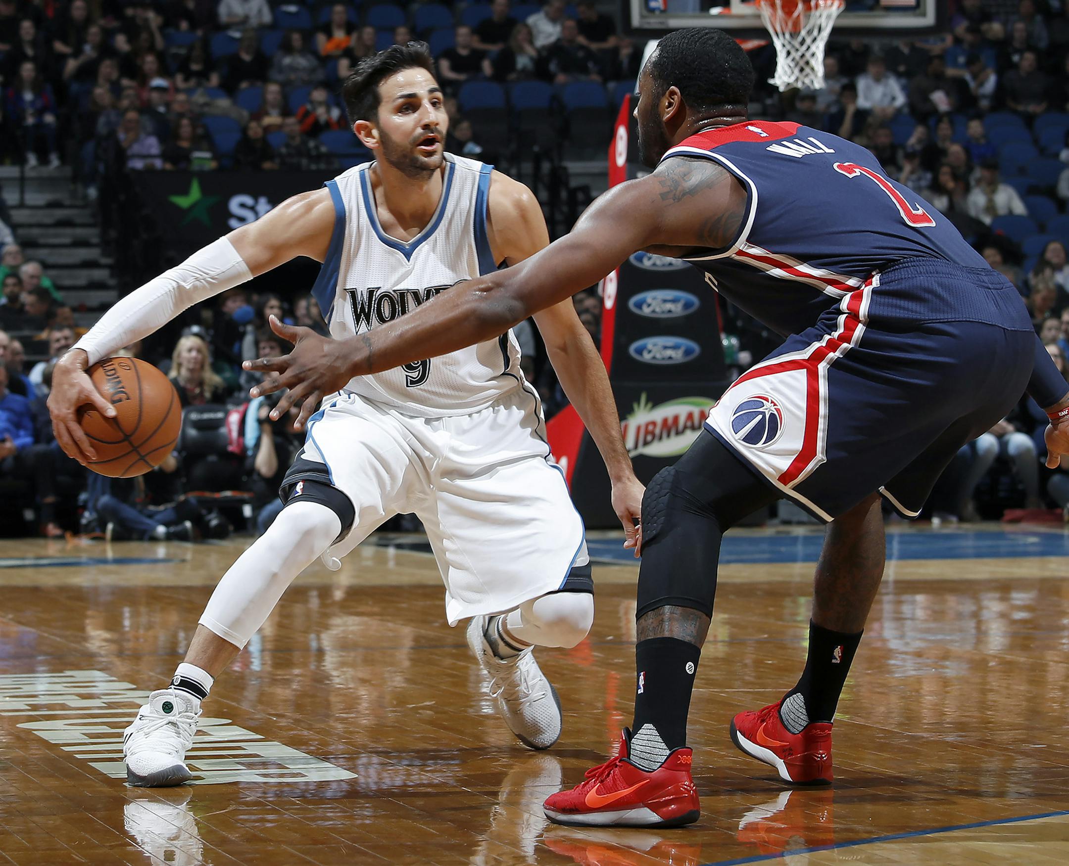 Minnesota Timberwolves' Ricky Rubio (9) is defended by Washington Wizards' John Wall (2) in the first quarter on Monday, March 13, 2017 at Target Center in Minneapolis, Minn. (Carlos Gonzalez/Minneapolis Star Tribune/TNS) ORG XMIT: 1198912 ORG XMIT: MIN1703132238400114