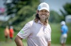 Aaron Baddeley watched golfers on the practice green Tuesday at the TPC Twin Cities.