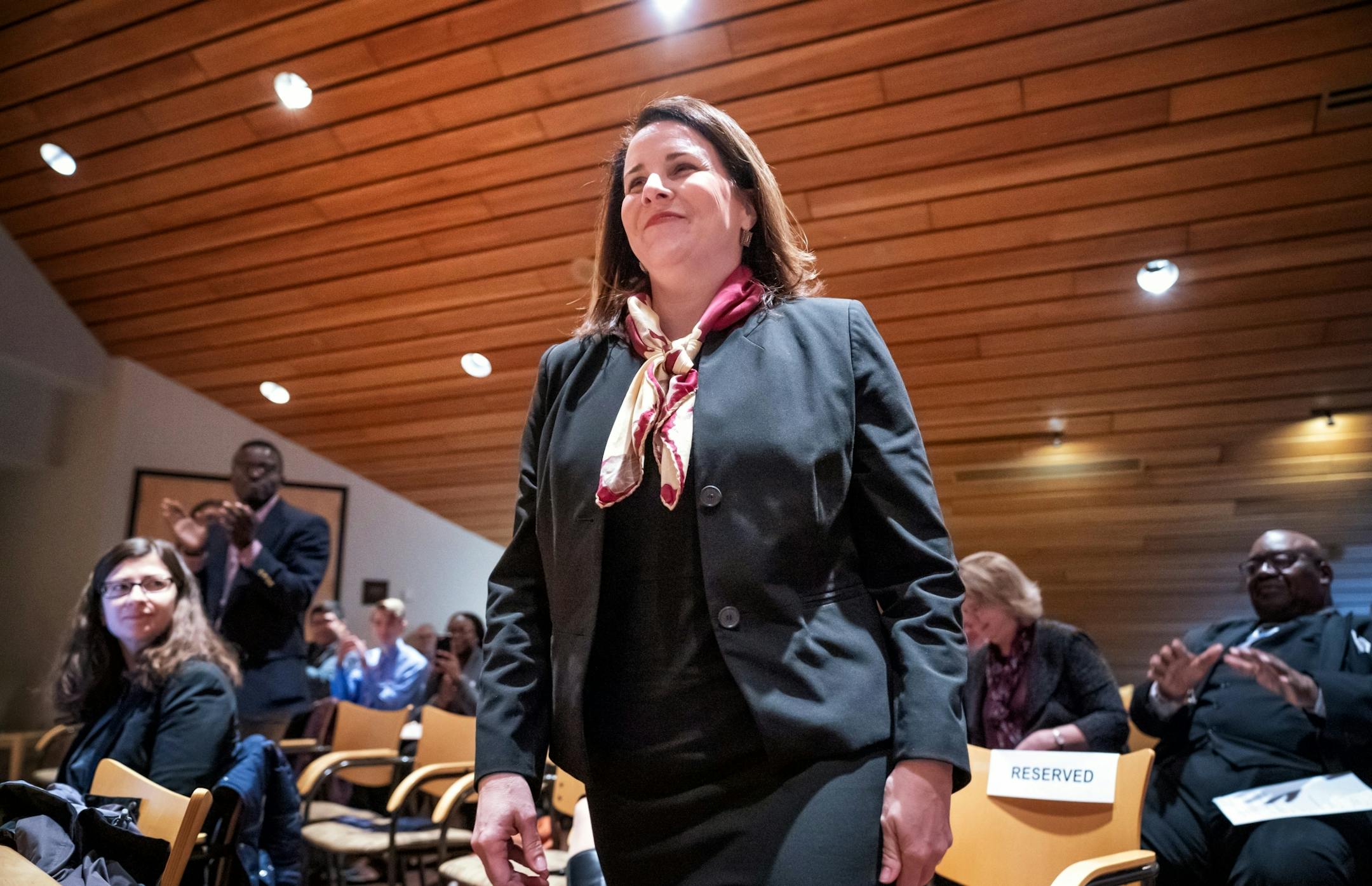 Joan Gabel rose to greet members of the Board of Regents after they unanimously voted to hire her as the university's first female president.