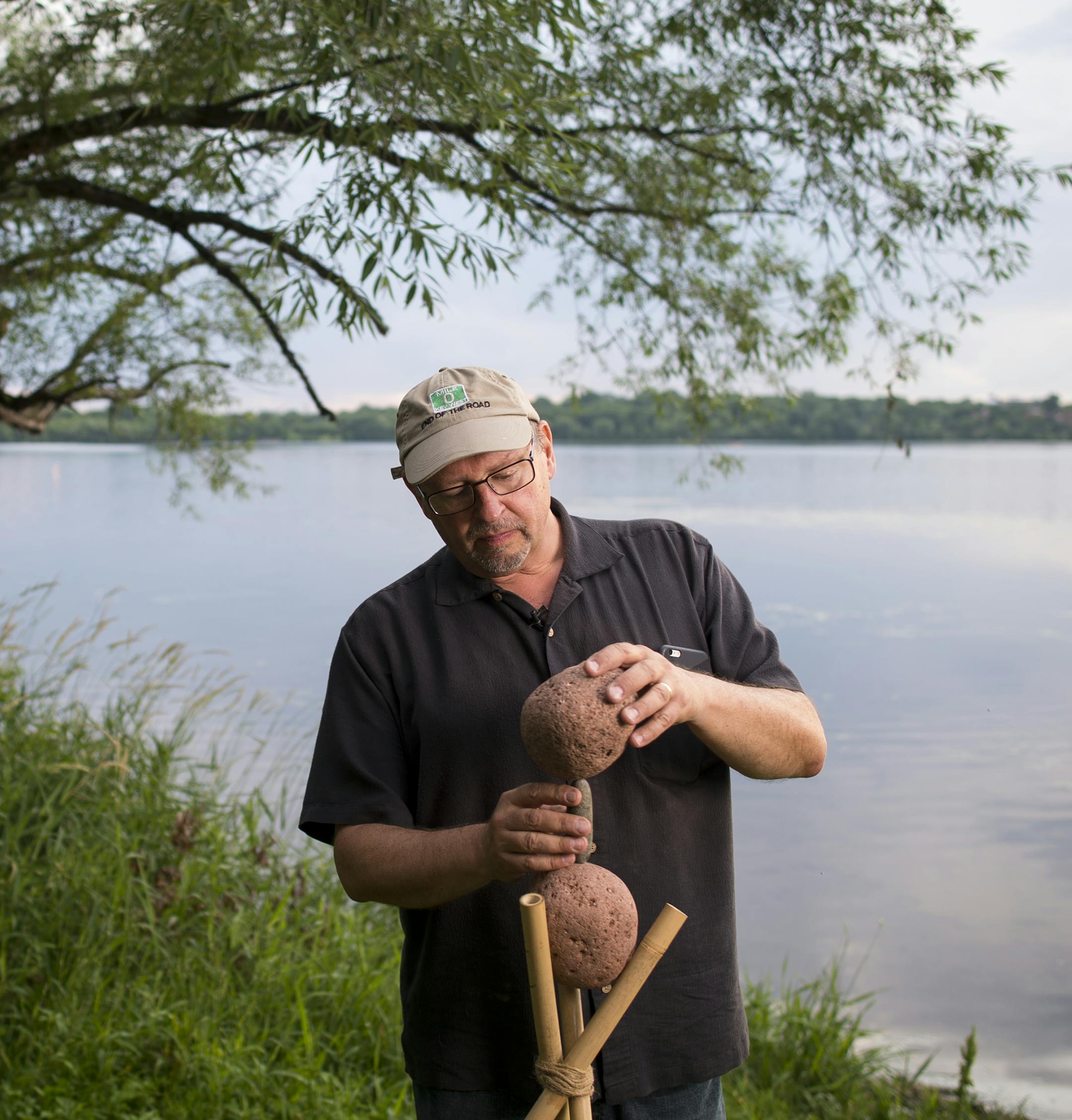 Peter Juhl worked on balancing Rocks Friday night at Lake Harriet. ] Aaron Lavinsky ¥ aaron.lavinsky@startribune.com Peter Juhl has made stacking rocks into an art form, but also boggles passers by with the feats of balance he achieves. Juhl was photographed Friday, June 26, 2015 near Lake Harriet's south beach.
