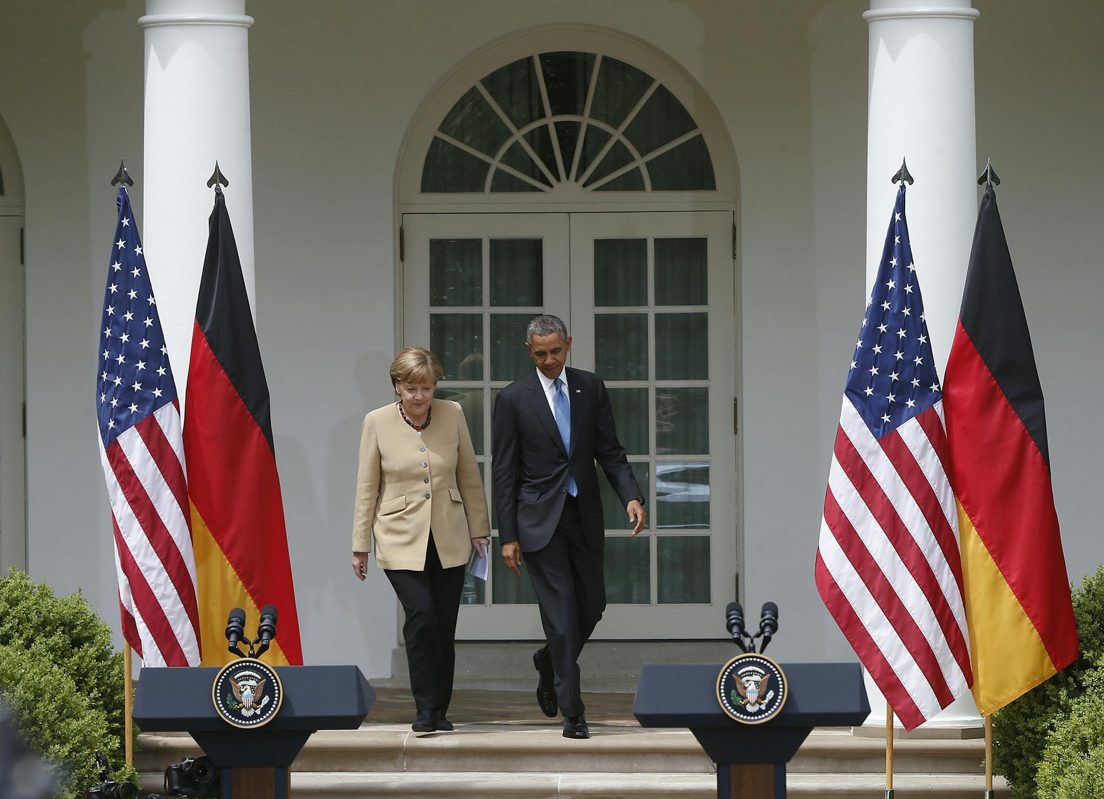 President Barack Obama and German Chancellor Angela Merkel arrive for a joint news conference in the Rose Garden at the White House in Washington, Friday, May 2, 2014. Obama and Merkel are putting on a display of trans-Atlantic unity against an assertive Russia, even as sanctions imposed by Western allies seem to be doing little to change Russian President Vladimir Putin's reasoning on Ukraine. (AP Photo/Charles Dharapak) ORG XMIT: MIN2014050915450430