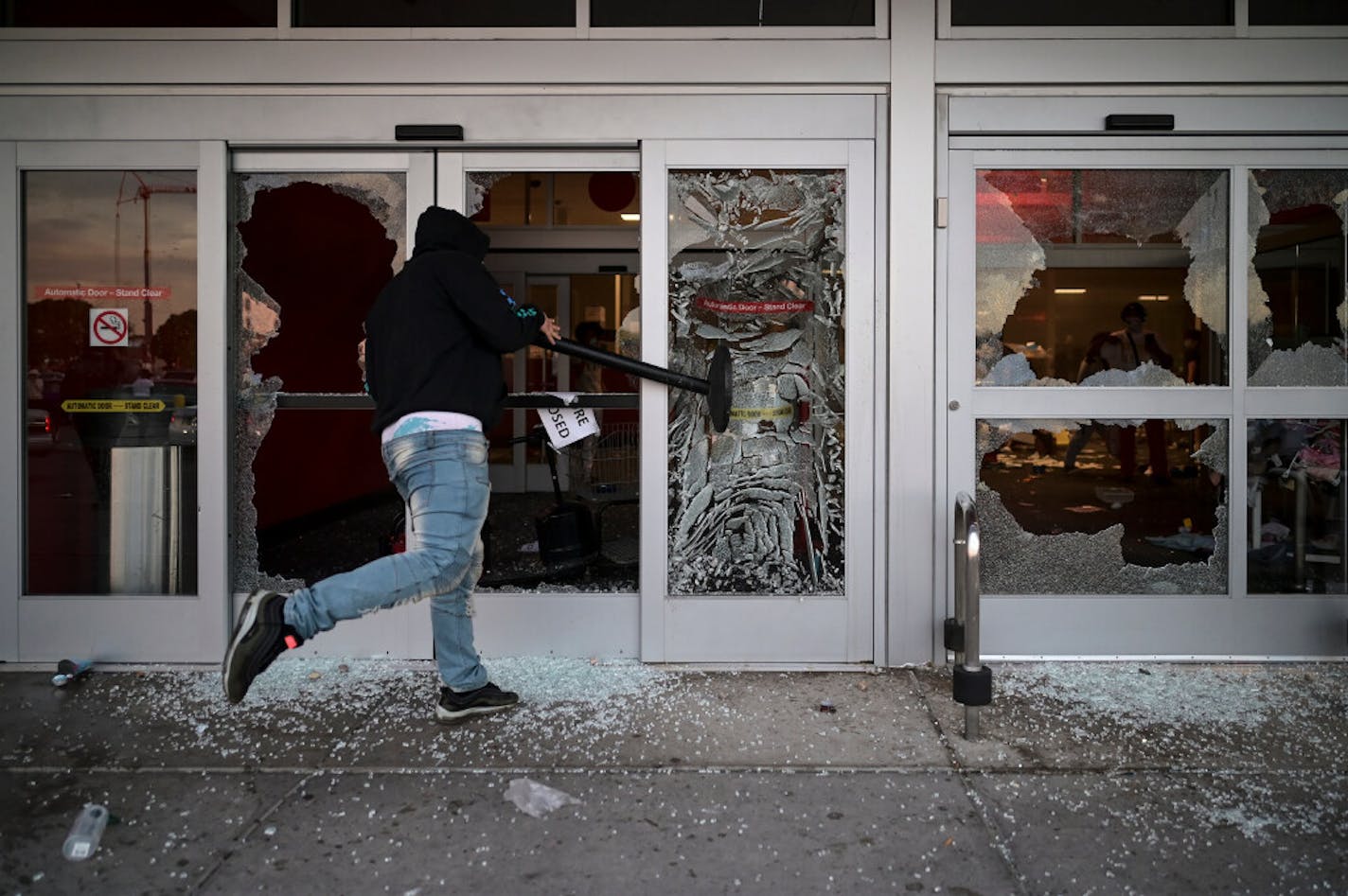 A protester smashed a window at Target across the street from the 3rd Precinct police station on Wednesday night.