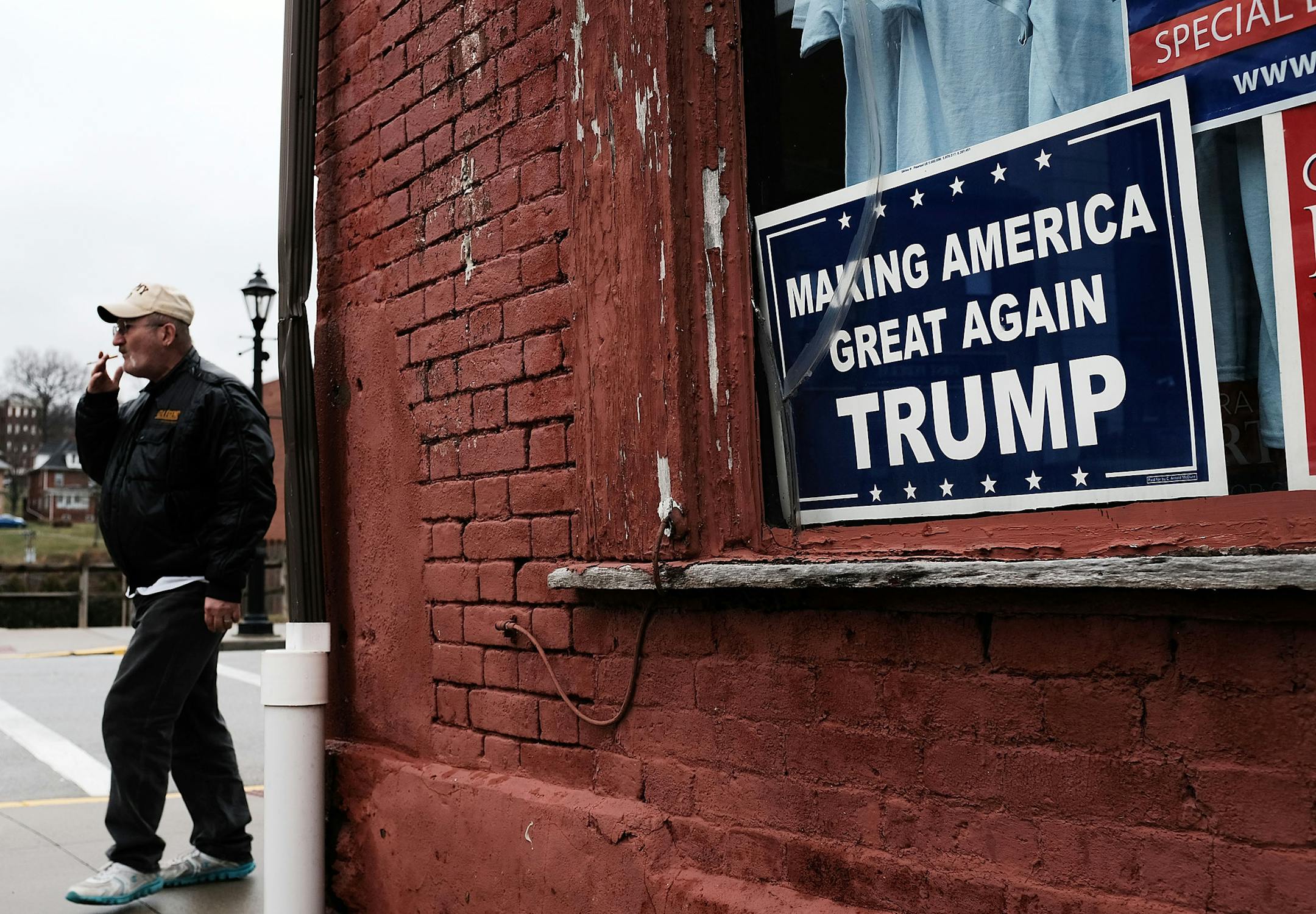 A Donald Trump sign hangs in the window in the town of Waynesburg near the West Virginia border on March 1, 2018 in Waynesburg, Pennsylvania. Waynesburg, once a thriving coal industry center, has struggled to find its footing in the new energy era. (Spencer Platt/Getty Images/TNS) ORG XMIT: 1794984
